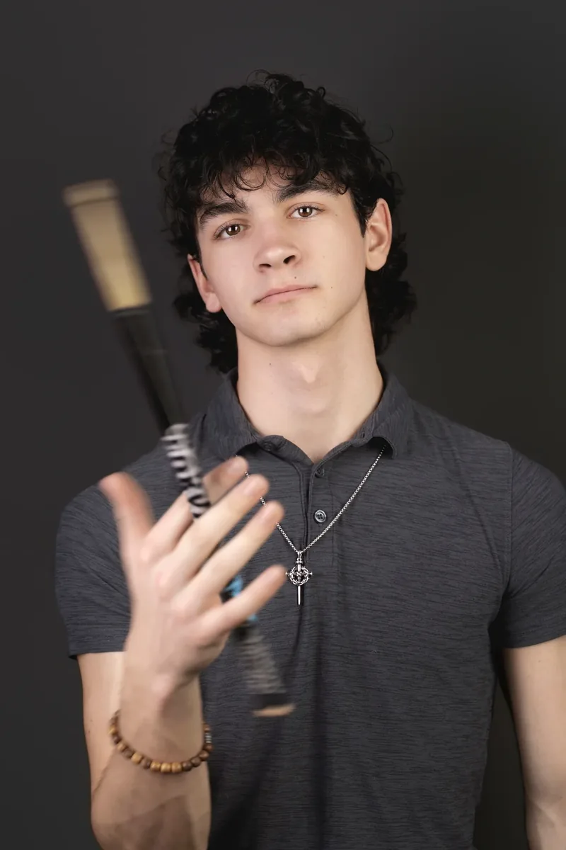 Portrait of Sean Mulvey with drumsticks